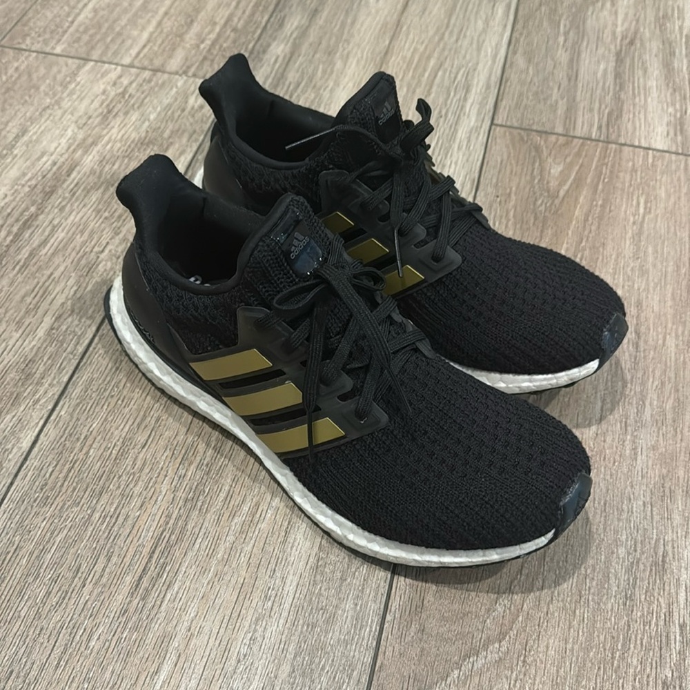 adidas Women's Ultraboost DNA Running Shoe, Black/Gold Metallic/White, 8.5